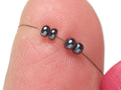 Four beads on thread